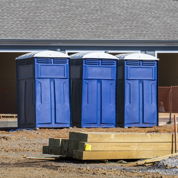 what is the cost difference between standard and deluxe portable restroom rentals in Forbes Road